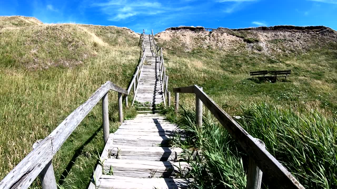 Stairs in the sand dunes with dune grass, bovbjerg, North Sea, hiking dunes, dike protection, Jutland, Denmark, 4k