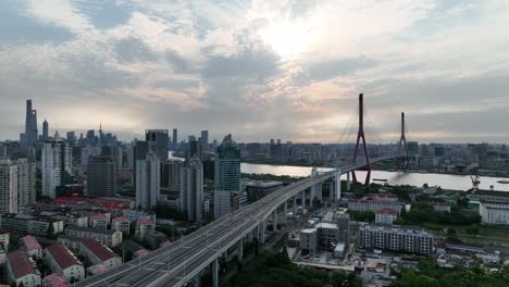 drone aerial view of buildings, cityscape and river in downtown