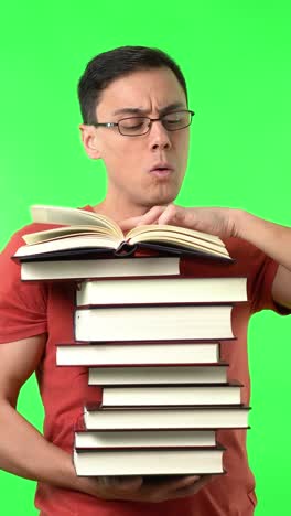 man reading a stack of books