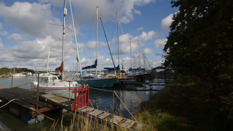 planning shot of sailboats moored up at high tide at ashlett creek sailing club in the solent, southampton