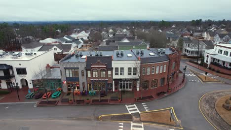 Aerial-pull-away-of-small-town-shops-and-eateries-at-Moss-Rock-Preserve-in-Hoover,-Alabama