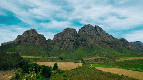 ndulge in the breathtaking allure of south africa's mountains as you witness the ever-changing patterns of moving clouds and the stunning green vistas in this mesmerizing hyperlapse footage