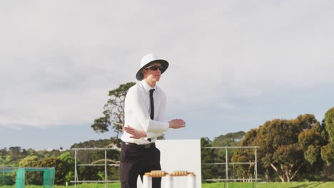 cricket umpire making signs standing on a cricket pitch