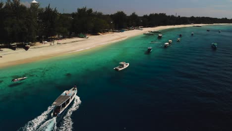 aerial view tourist boat on the beach from a drone