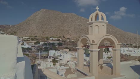 landmark belltower in akrotiri village in santorini, greece