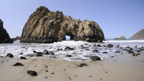 time lapse of waves breaking through a rock at pfeiffer beach in big sur california