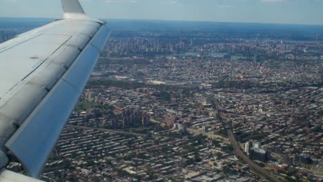 airplane flying over new york city preparing to land