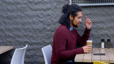couple interacting to each other at outdoor cafe 4k