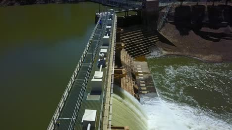 Person-walking-along-the-Goulburn-Weir,-Victoria,-Australia