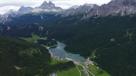 aerial view of lake misurina surrounded by dolomites alps mountains