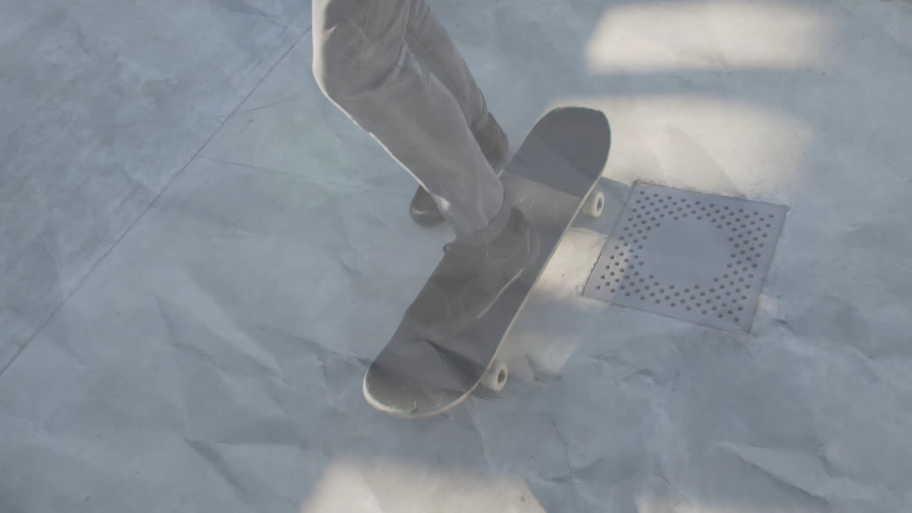 Male skateboarder performing ollie on sunlit concrete skatepark, highlighting business data graph