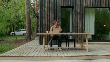 man working remotely on a deck