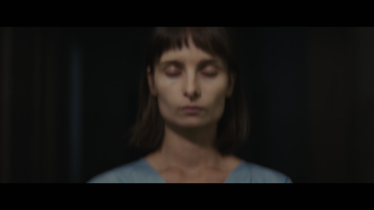 A girl in a dark corridor at night
