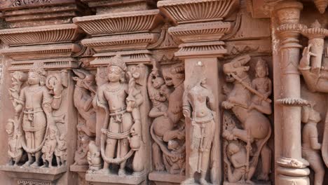 ancient hindu temple artistic wall decorated with god and goddess idols at day from different angle