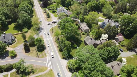 Beautiful-aerial-drone-flying-over-typical-American-suburb-housing-estate-in-summer