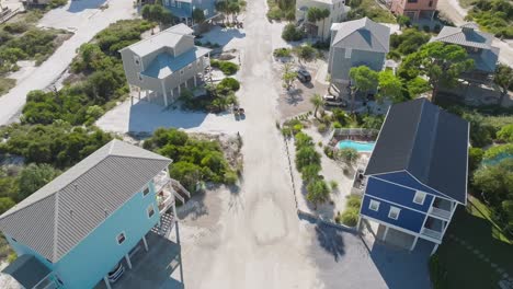 Aerial-flying-through-beautiful-condos-towards-ocean-at-Cape-San-Blas,-Florida