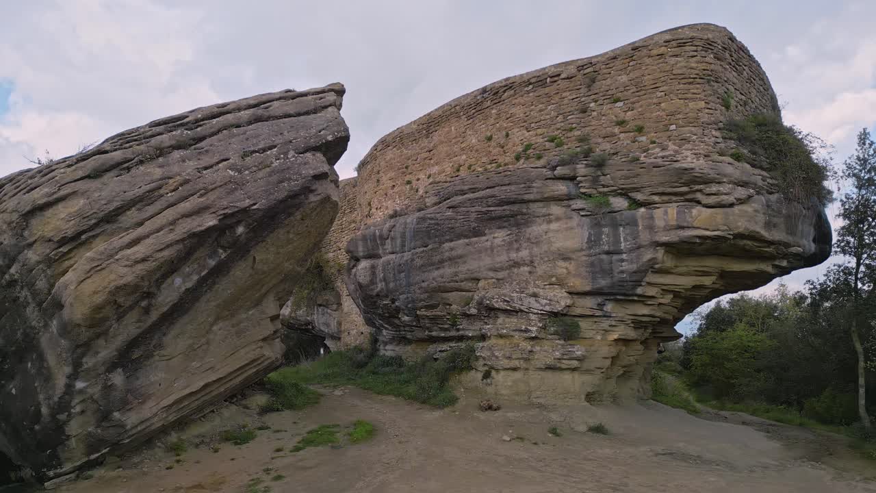 Majestic medieval taradell castle, built atop a massive rock formation in catalonia, stands as a testament to eight centuries of history and architectural ingenuity