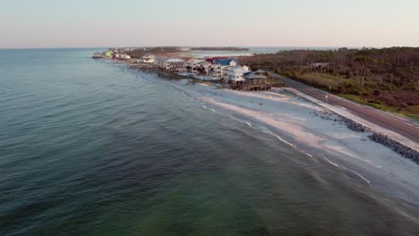 aerial flight towards beach front homes in cape san blas, florida