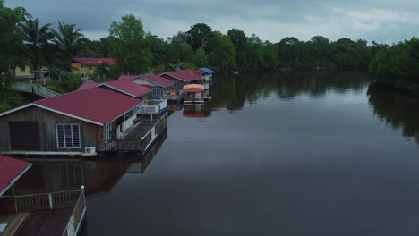 drone top view of village near river in rompin pahang, malaysia