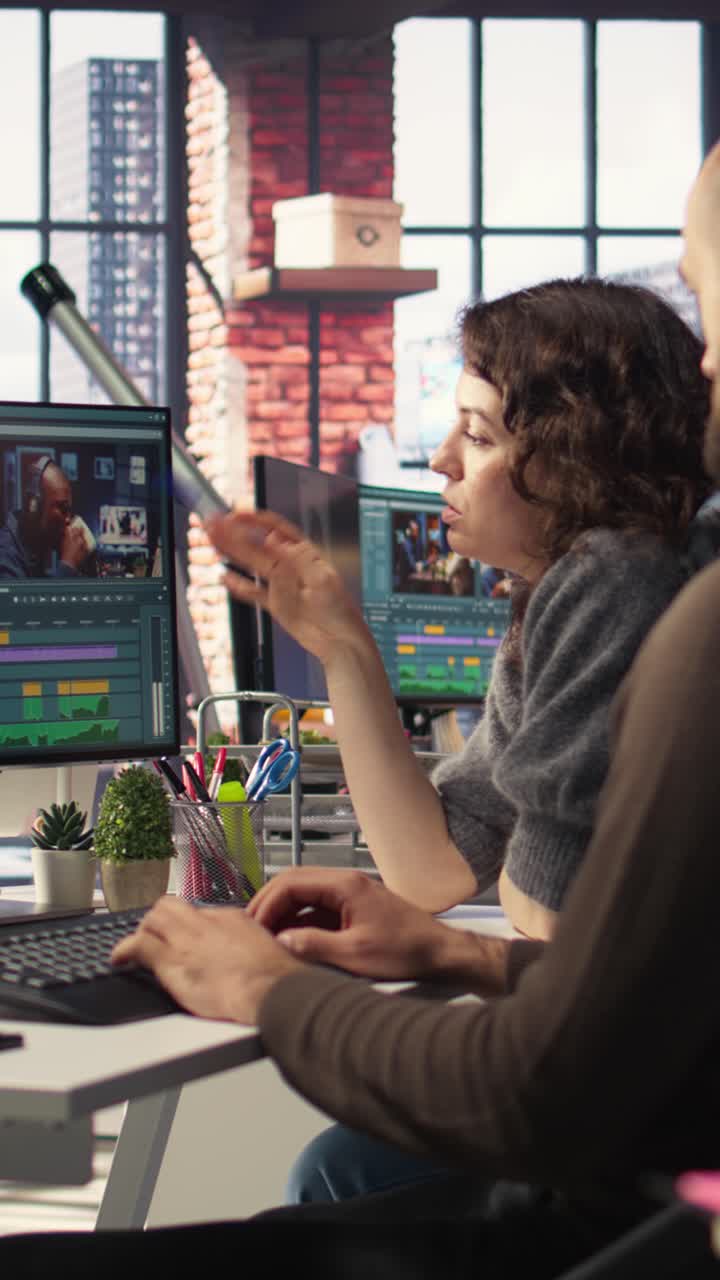 Vertical Video Man and woman filmmakers editing video shoot in post production