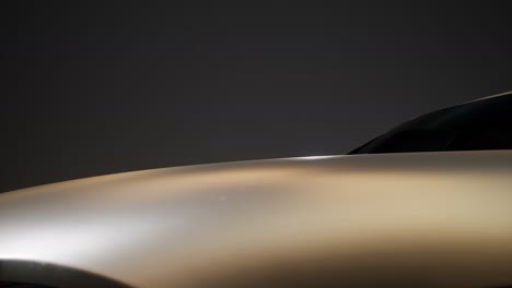 luxury sport car in dark studio with bright lights