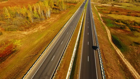 top view straight road on background autumn landscape. autumn forest and road