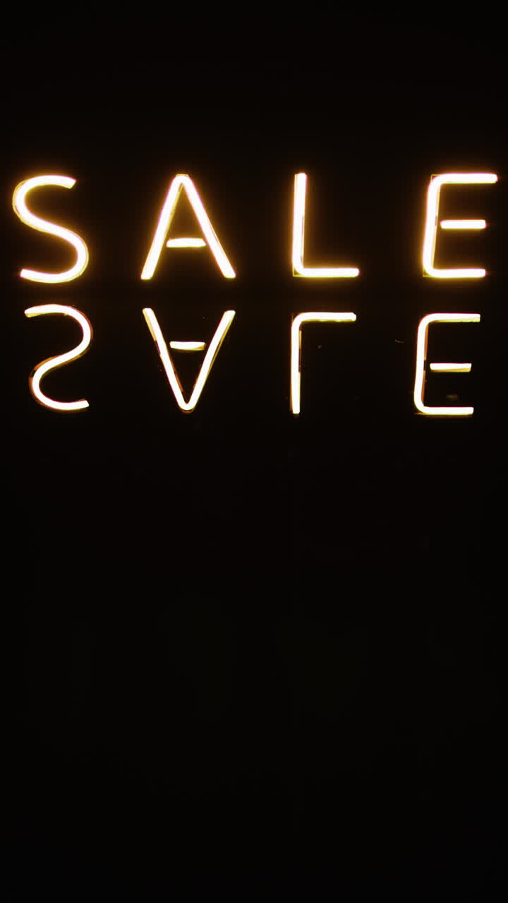 vídeo vertical de texto de venta de neón en fondo negro
