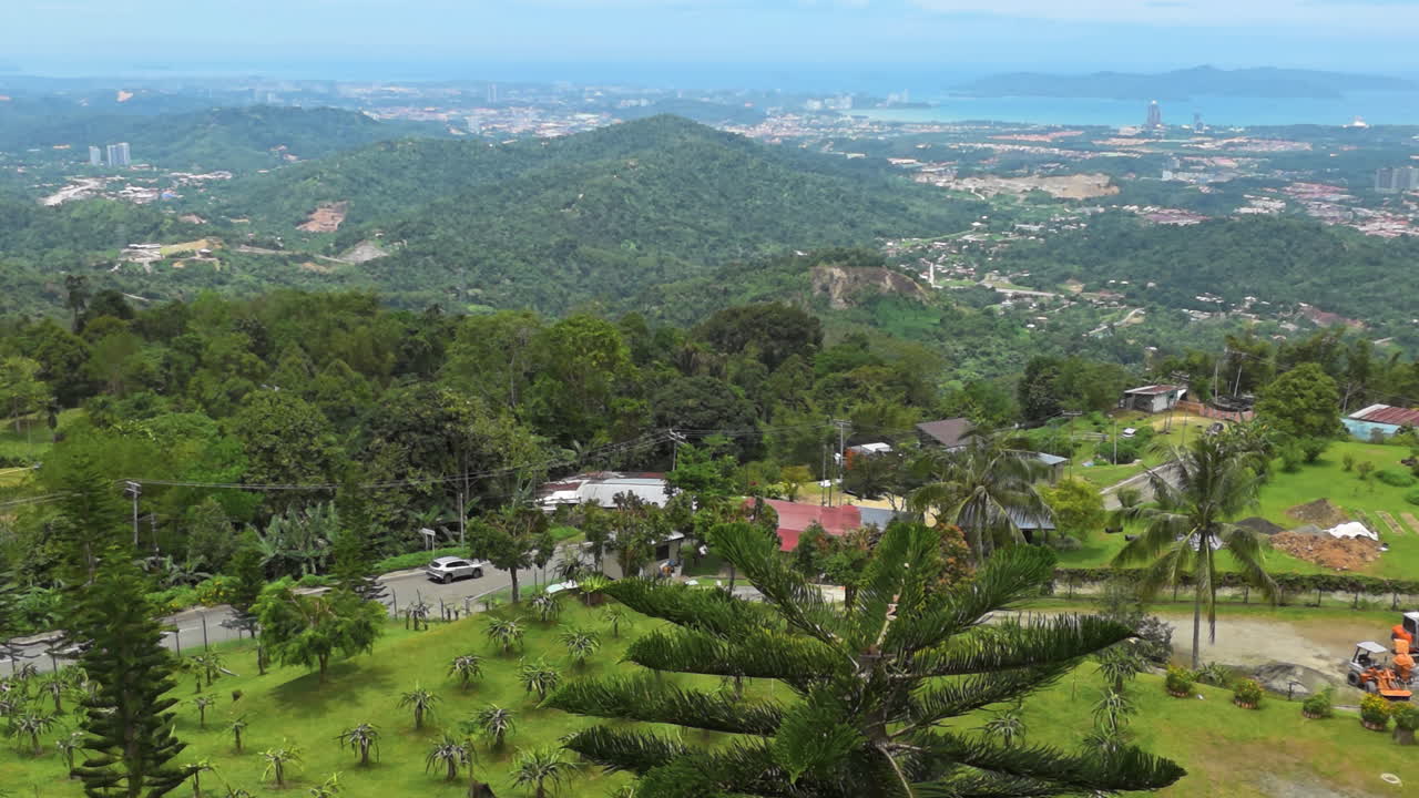 Kota Kinabalu From Kokol Hill With Lush Greenery Landscape And Villages In Sabah, Malaysia. Aerial Panning Shot