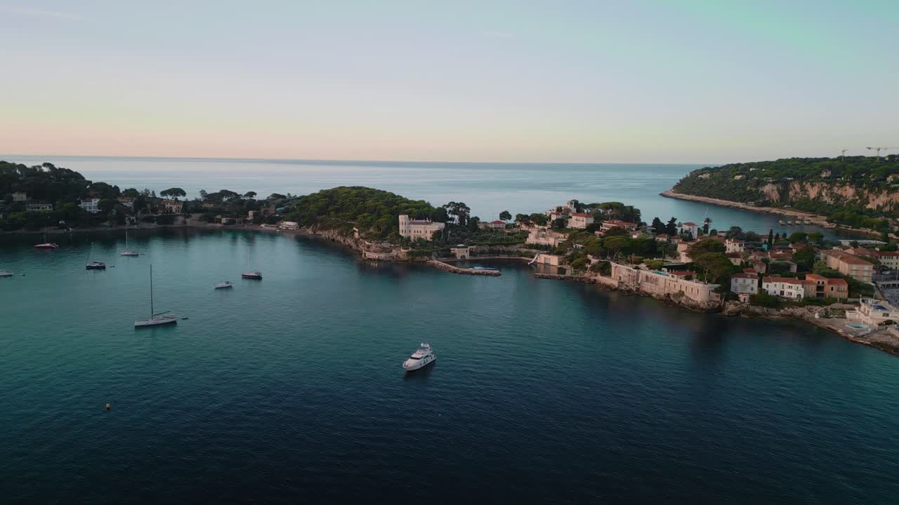 Aerial View Of Cap-Ferrat Region In Côte d'Azur France, Luxury Houses Along Coastline With Sailboats
