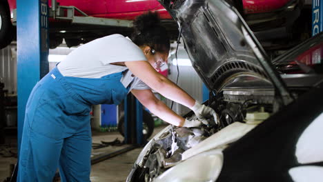 Woman-repairing-car