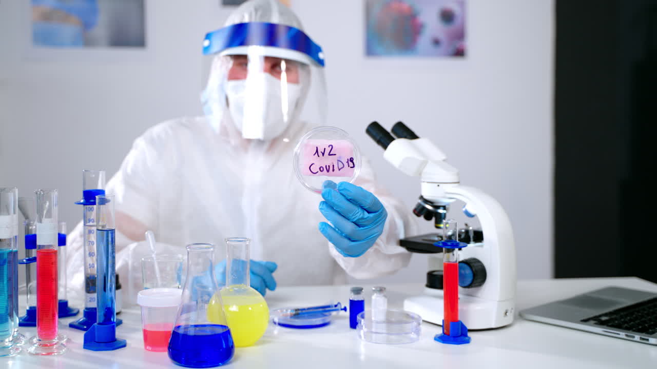 Scientist Holding Petri Dish with COVID-19 Sample