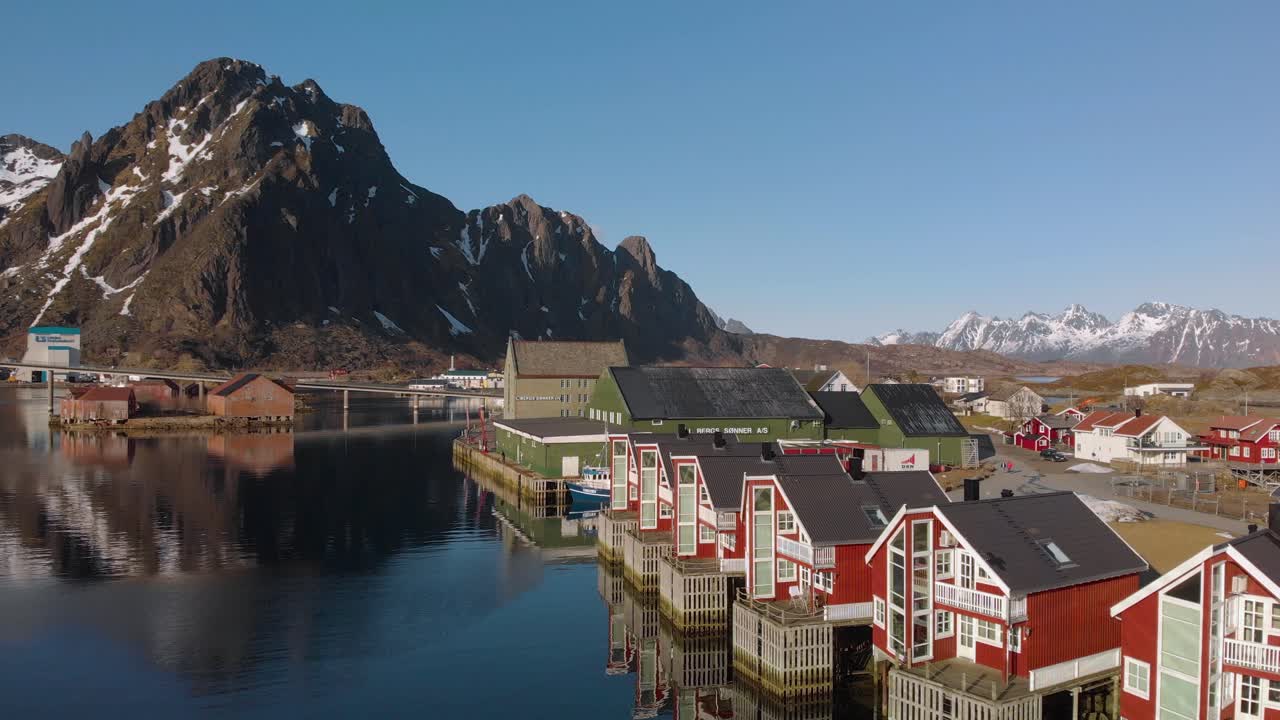 Aerial drone shot paning from red hoses to a big mountain in the background