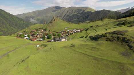 drone shot of man riding a horse in upper omalo, tusheti georgia