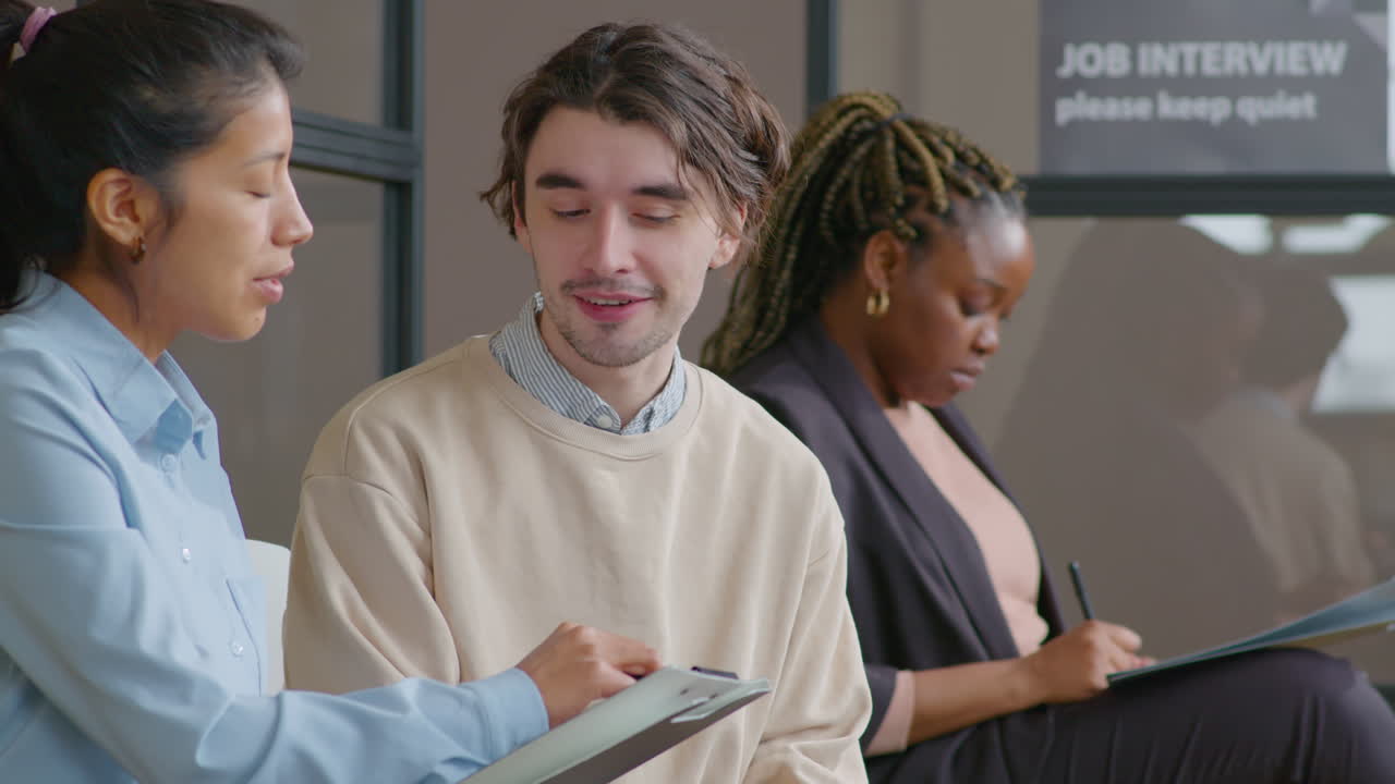 Job Applicants Speaking in Line before Interview