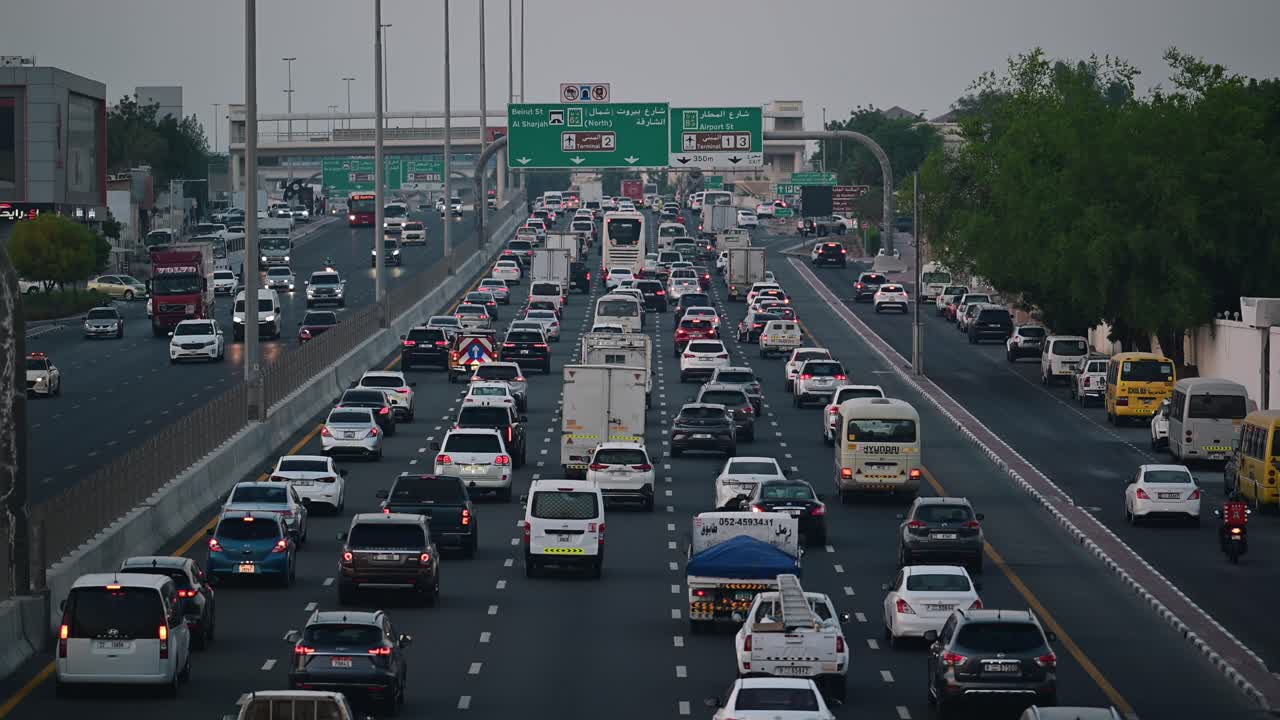 Slow-moving evening traffic on Nadd Al Hamar Road in Dubai, heading towards Sharjah, United Arab Emirates.