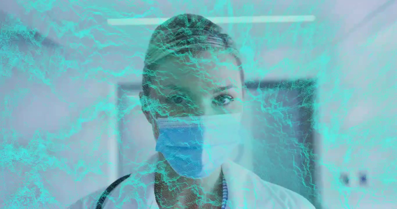 Medico che reagisce a un'interfaccia turchese che si muove sul viso, raddrizzando lo sguardo, rivelando gli occhi, maschera.
