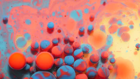 slow motion bright pastel color bubbles oil beautiful milk paint sparkling color moving multicolor close up. acrylic blue paint. fantastic surface. abstract colorful transformation gravitation.