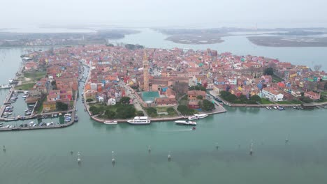 wide aerial of whole island of burano on a foggy day.