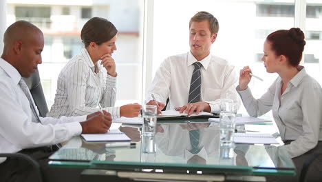 Business-team-talking-together-in-a-conference-room