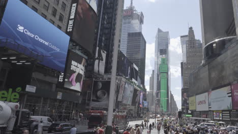 pov view of the main street in new york with a tourist bus driving past in the street.