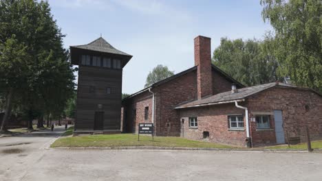 auschwitz concentration camp in poland with brick buildings and guard tower during a clear day