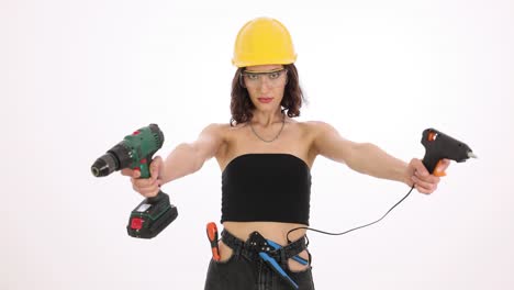confident female worker with power tools and hard hat