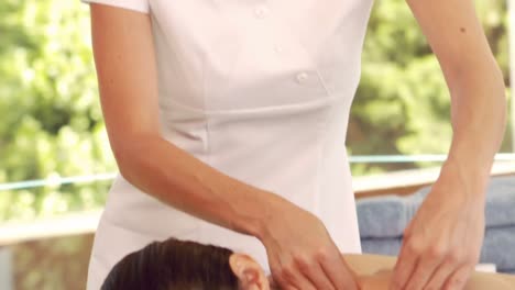 serious woman giving a massage