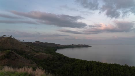 scenic coastal landscape with hills and cloudy sky at dusk