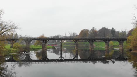 water reflection illusion of bridge