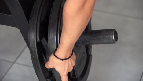 a woman engages in a strength training workout at a modern gym, demonstrating proper lifting techniques while using a weight bar. focus on fitness and athleticism is evident