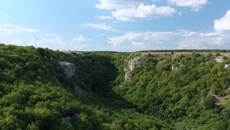 Aerial-of-wind-turbine-park-above-a-lush-green-valley