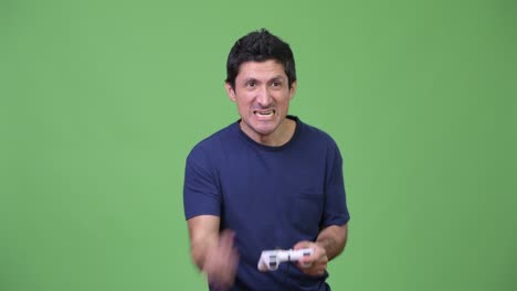 hispanic man playing games and winning