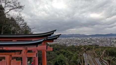 time-lapse of torii gates with changing clouds