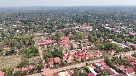 this aerial view captures a temple complex, likely in southeast asia given the architectural style, possibly wat preah vihear based on the context. the temple features tiered roofs with ornate